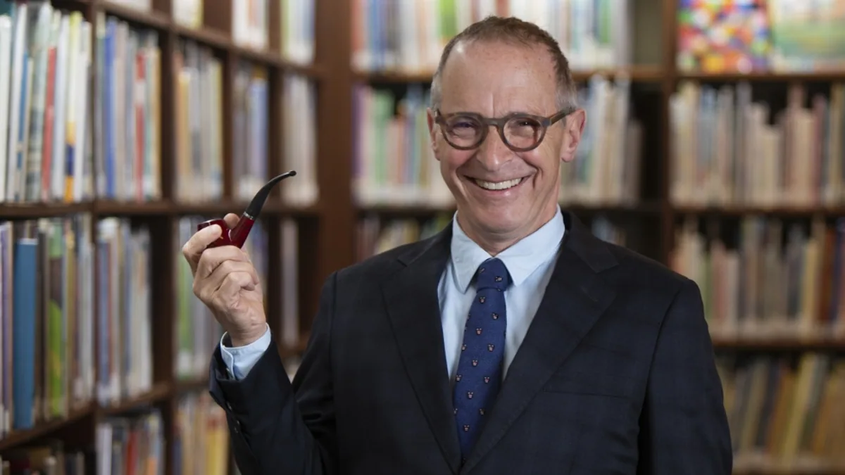 David Sedaris photographed in a library by Anne Fishbein