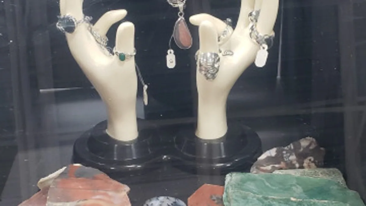 Handcrafted jewellery and stones in an OLMC show display