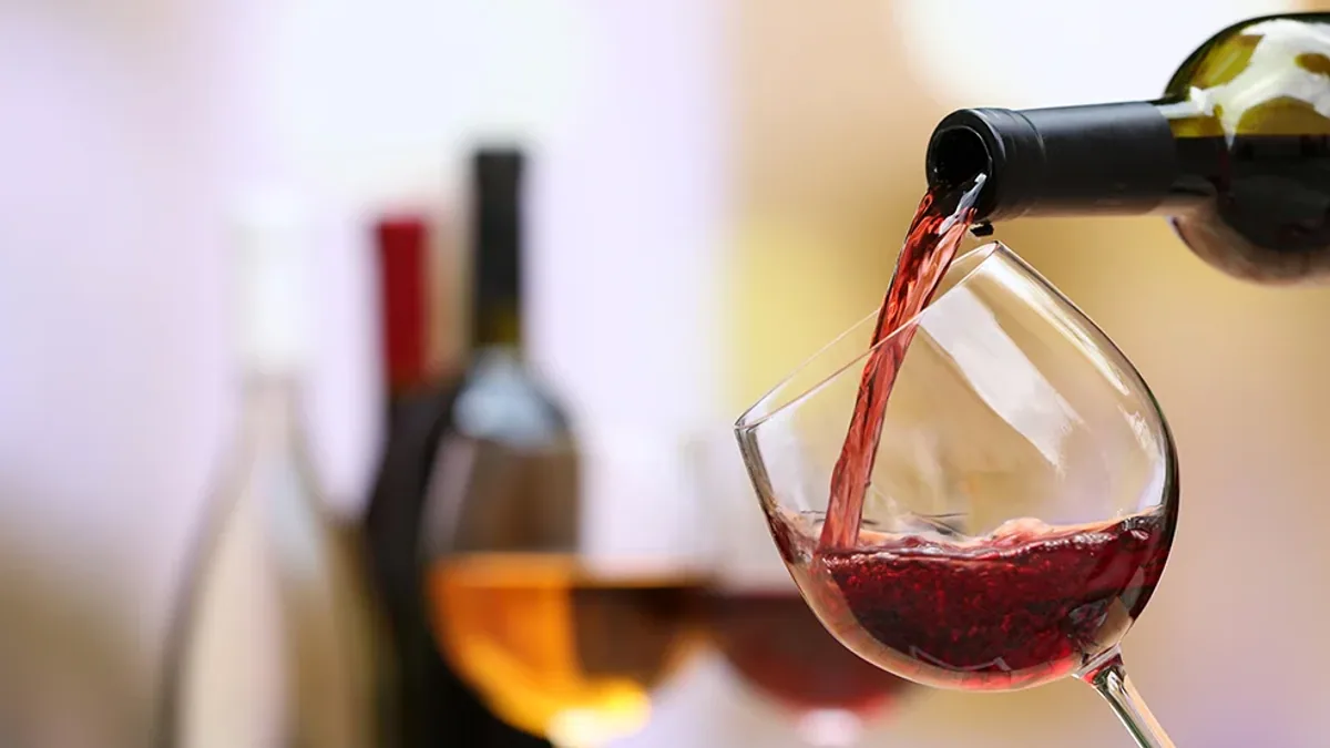 Red wine being poured into a glass